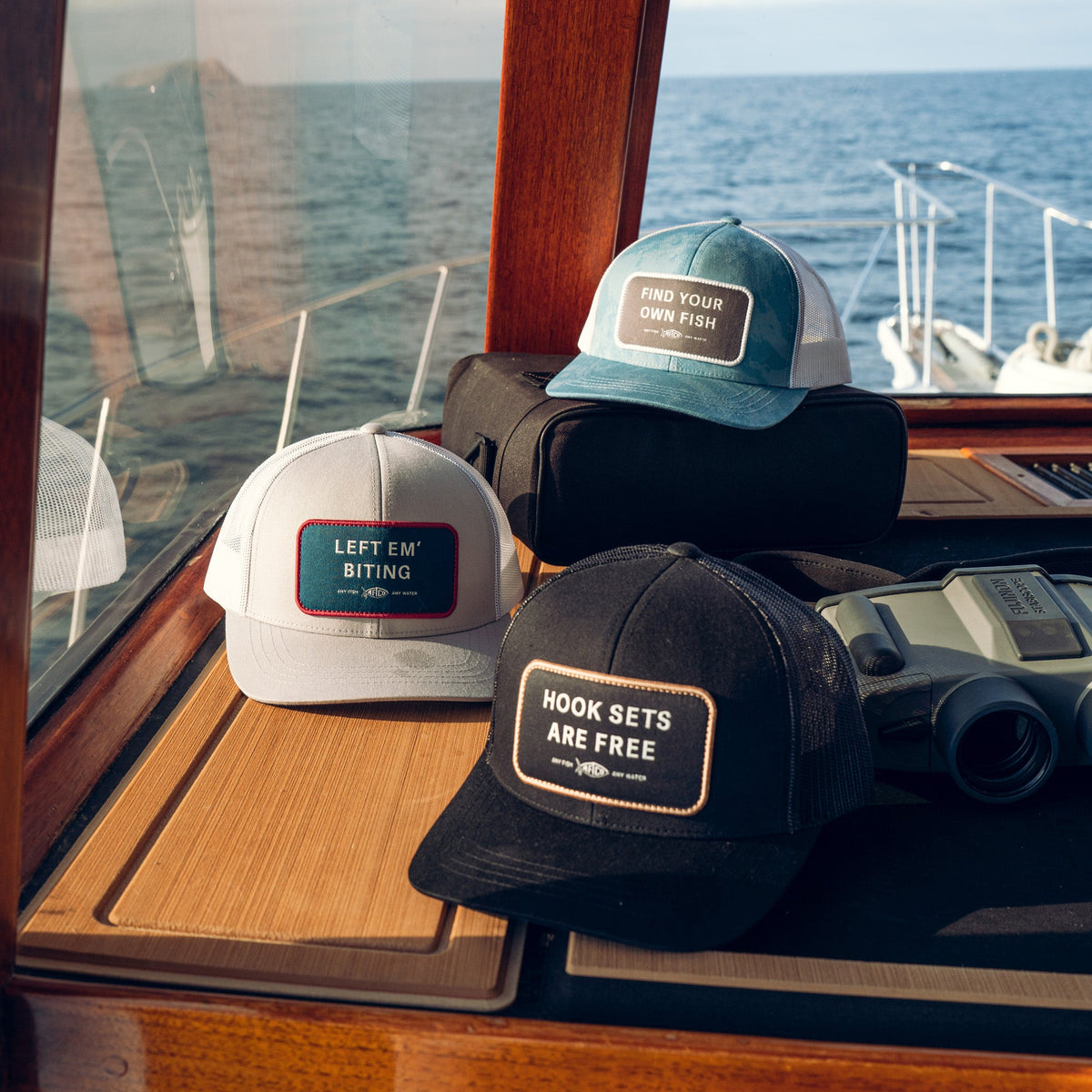 Left Em' Biting Fishing Trucker Hat